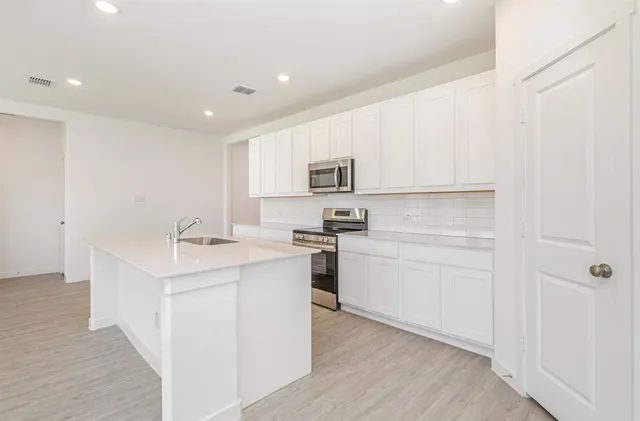 a view of kitchen with wooden floor