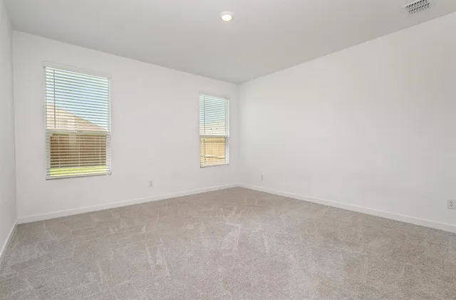 a kitchen with a sink cabinets and wooden floor