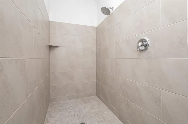 a kitchen with stainless steel appliances a sink stove and cabinets