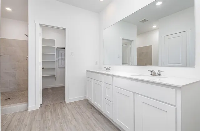 a kitchen with granite countertop a sink and a stove top oven