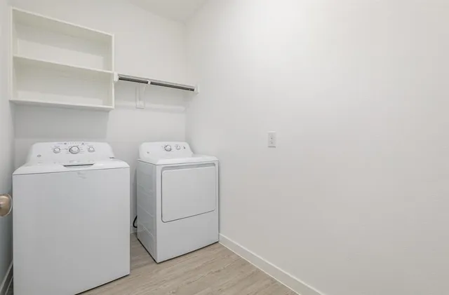 a bathroom with a double vanity sink and mirror