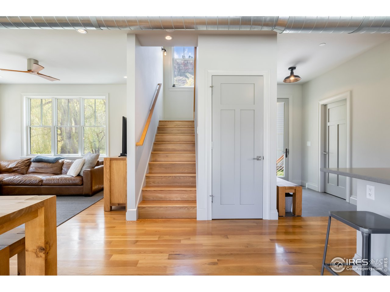 354 Apple Valley Road Lyons, CO 80540 - Photo 12 of 40 a view interior of the house and livingroom with furniture wooden floor and windows