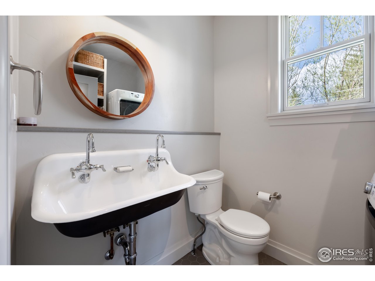 354 Apple Valley Road Lyons, CO 80540 - Photo 15 of 40 a bathroom with a sink a mirror and a toilet
