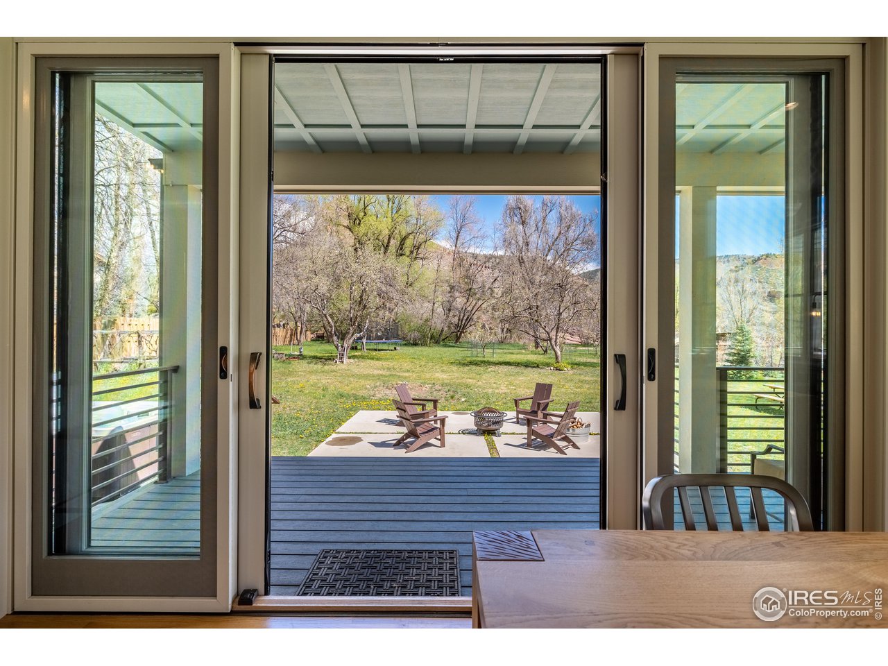354 Apple Valley Road Lyons, CO 80540 - Photo 16 of 40 a view of a living room and floor to ceiling window