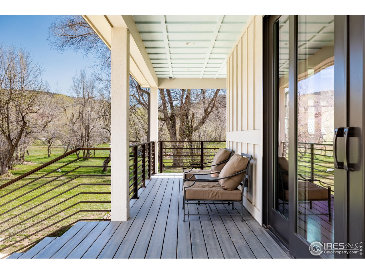 354 Apple Valley Road Lyons, CO 80540 - Photo 17 of 40 a view of a balcony with chairs
