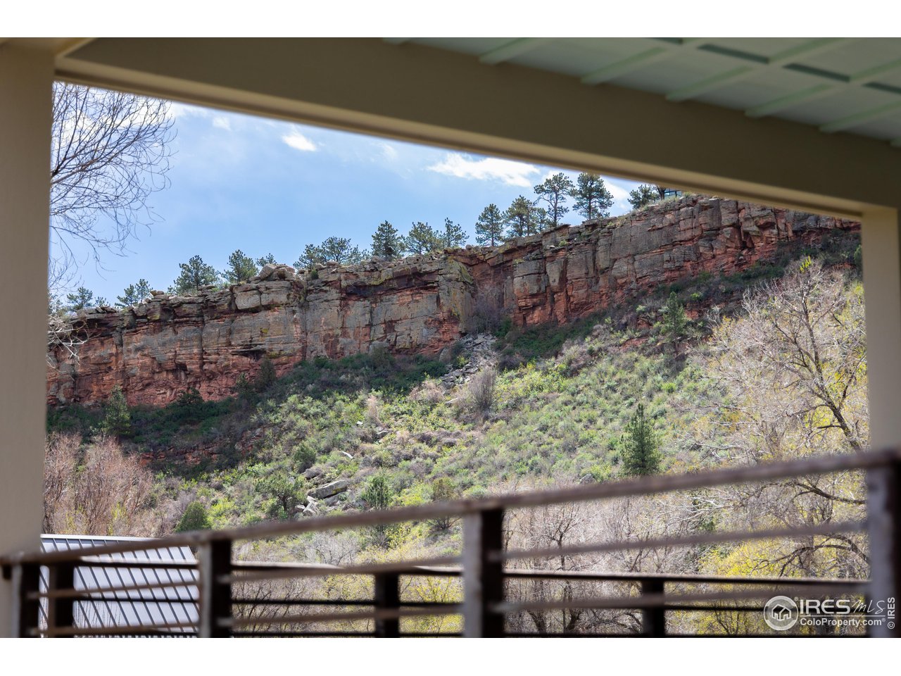 354 Apple Valley Road Lyons, CO 80540 - Photo 18 of 40 a view of a yard from a balcony