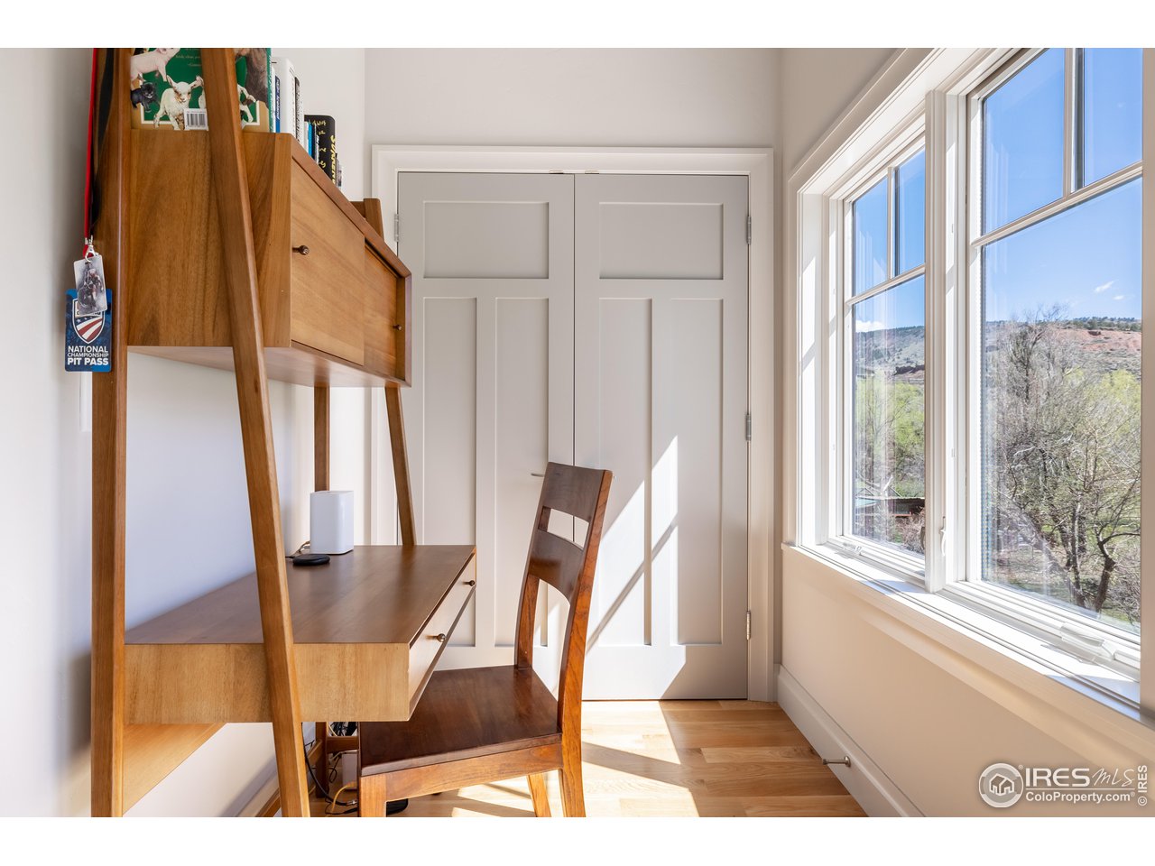 354 Apple Valley Road Lyons, CO 80540 - Photo 23 of 40 a view of a dining room with furniture window and wooden floor