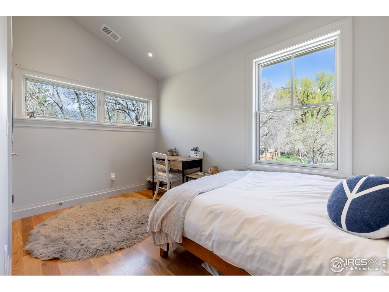 354 Apple Valley Road Lyons, CO 80540 - Photo 27 of 40 a bedroom with a bed and a window