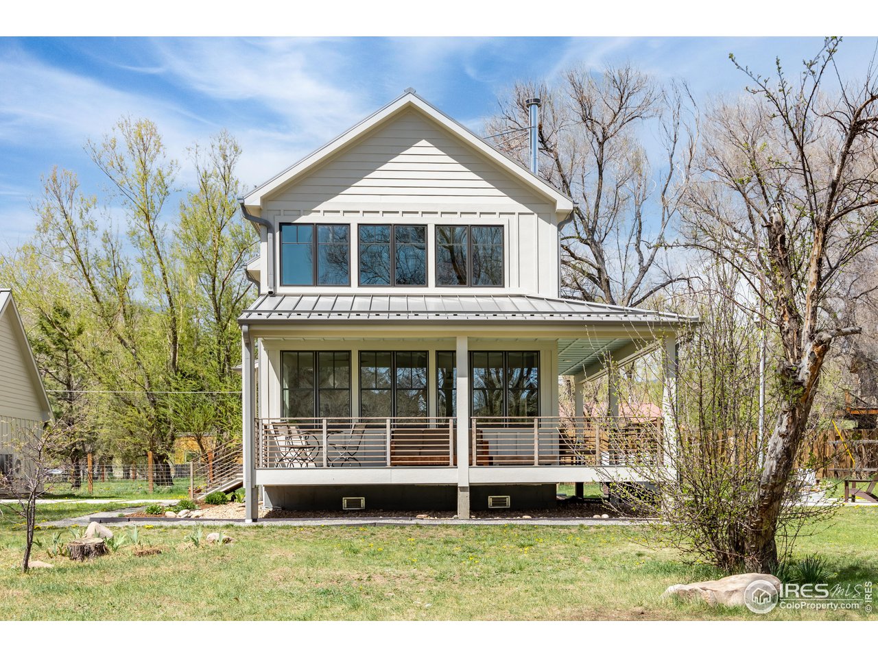 354 Apple Valley Road Lyons, CO 80540 - Photo 33 of 40 a front view of a house with a yard