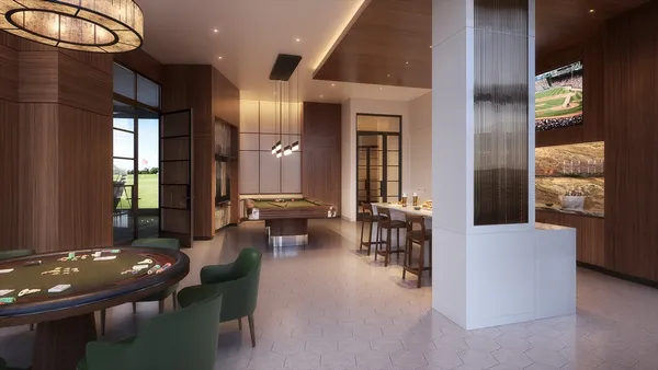 a living room with furniture a table and chairs
