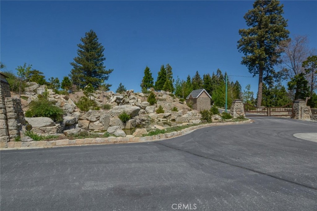 284 Hidden Forest Road Lake Arrowhead, CA 92352 - Photo 4 of 8 a view of a road with a garden