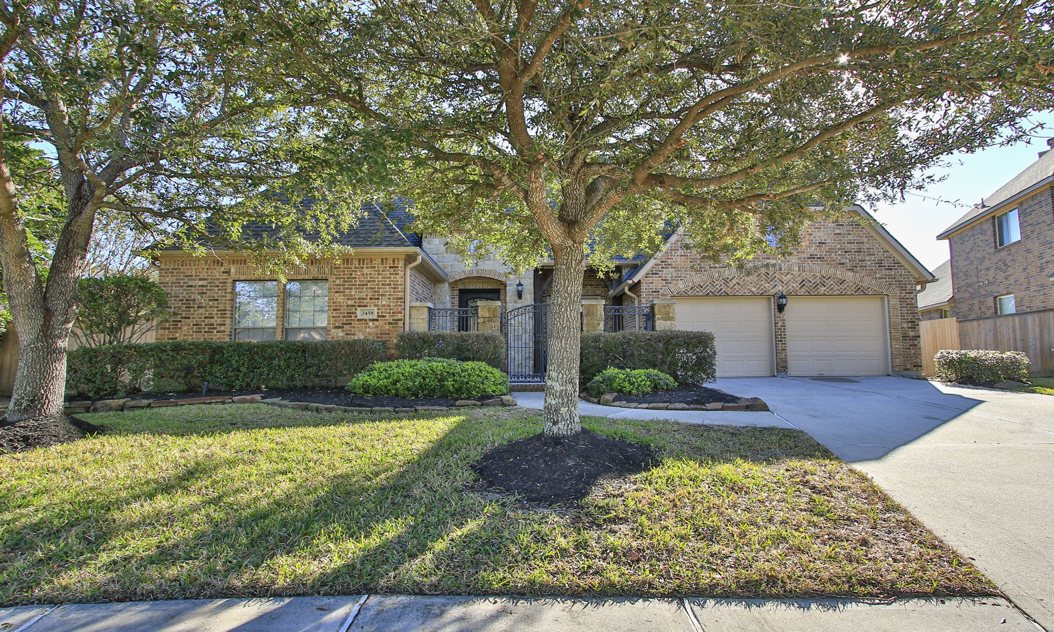 Great curb appeal in a gated neighborhood.  Notice the gated courtyard at the entrance to the home.