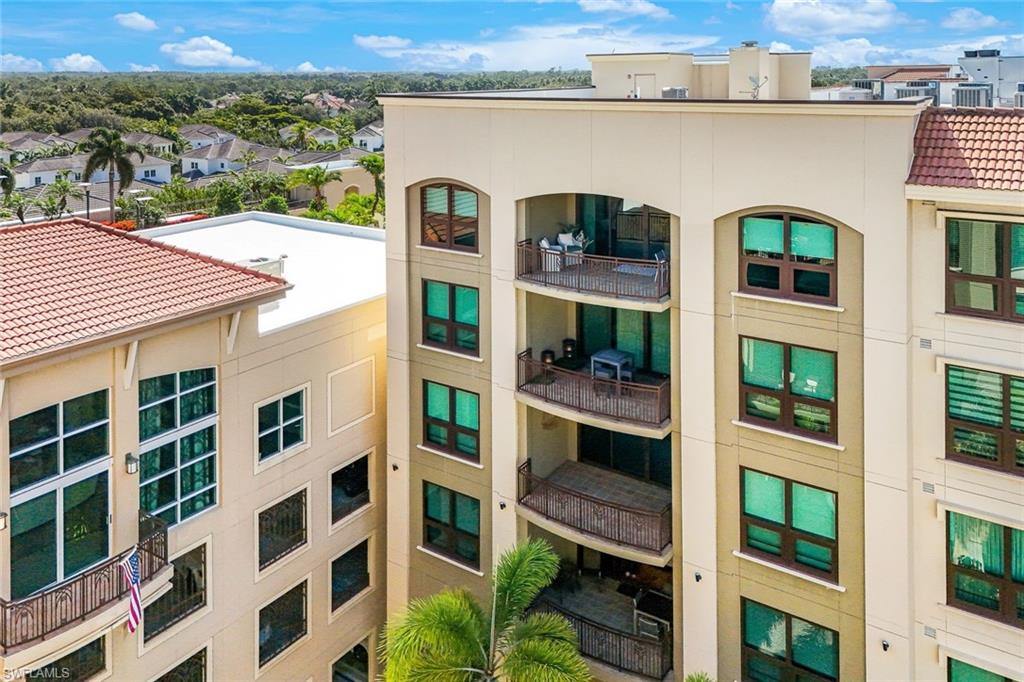 9123 Strada Place, Unit 7201 Naples, FL 34108 - Photo 22 of 50 a front view of a multi story building