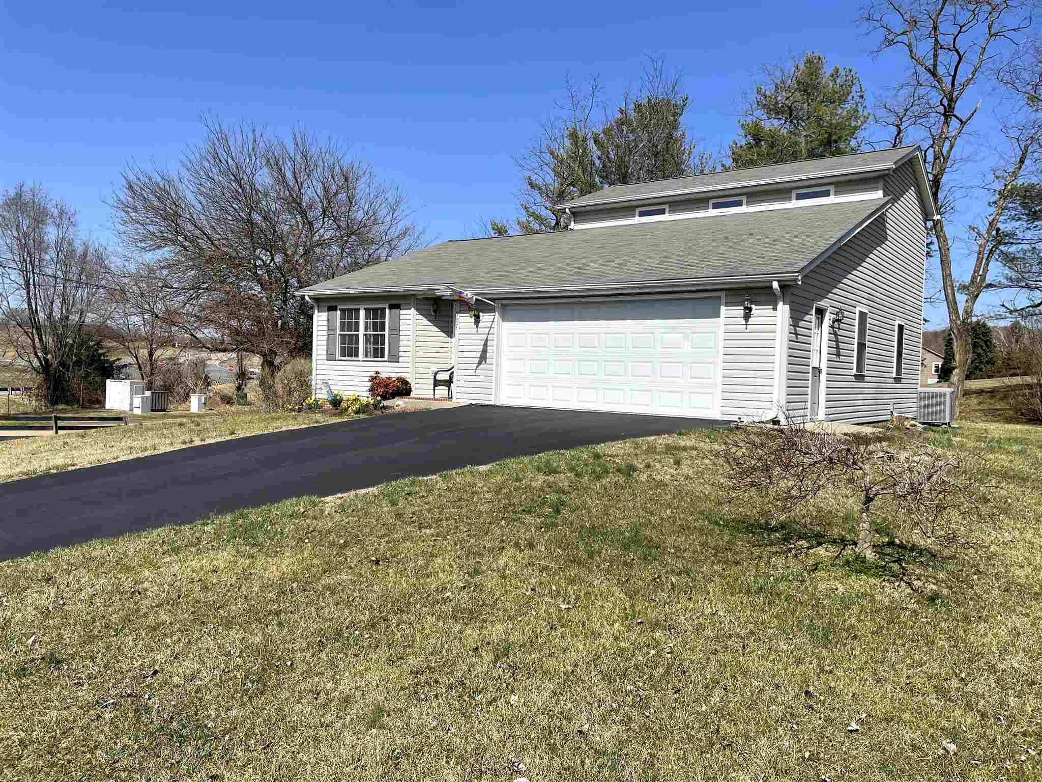 907 Reaper Road Staunton, VA 24401 - Photo 2 of 29 a front view of a house with a yard and garage