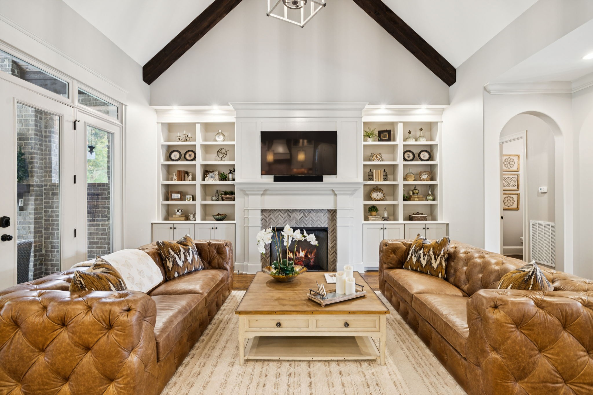 1741 Ravello Way Brentwood, TN 37027 - Photo 15 of 80 a living room with furniture a fireplace and a flat screen tv