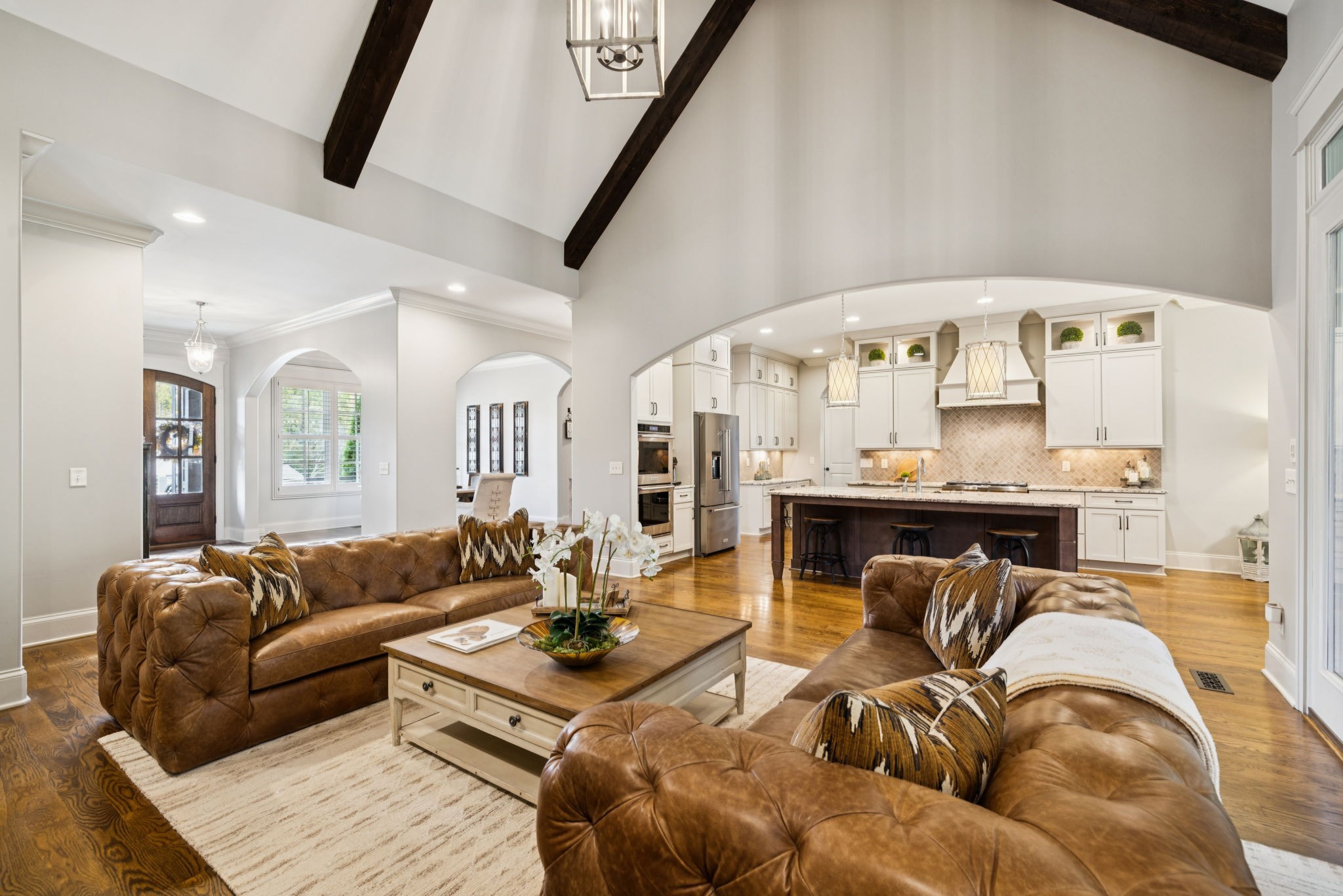 1741 Ravello Way Brentwood, TN 37027 - Photo 16 of 80 a living room with furniture and a chandelier