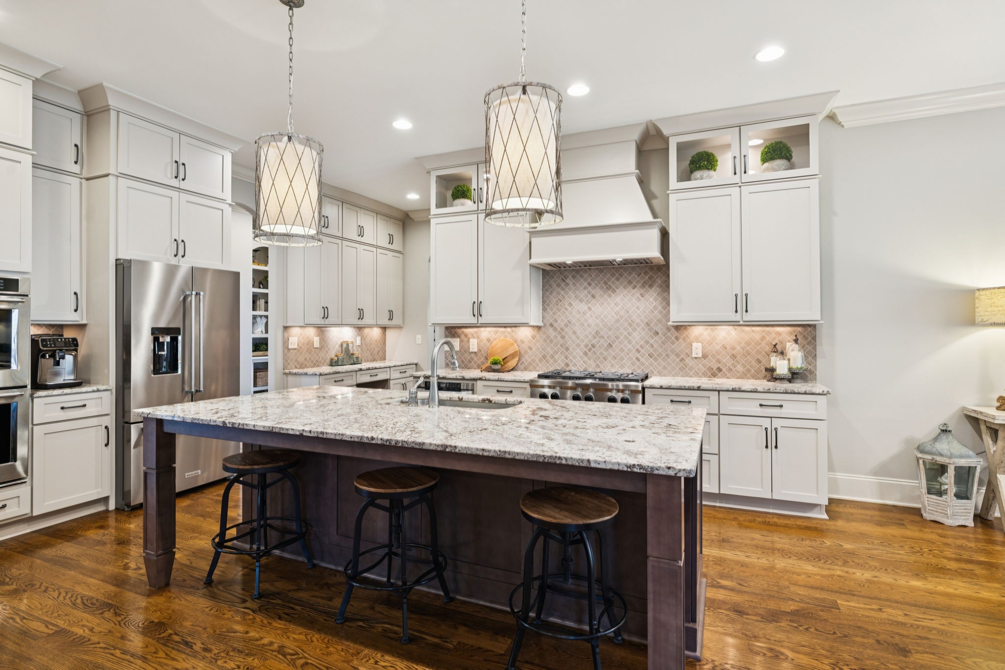 1741 Ravello Way Brentwood, TN 37027 - Photo 20 of 80 a kitchen with stainless steel appliances granite countertop a sink stove and refrigerator