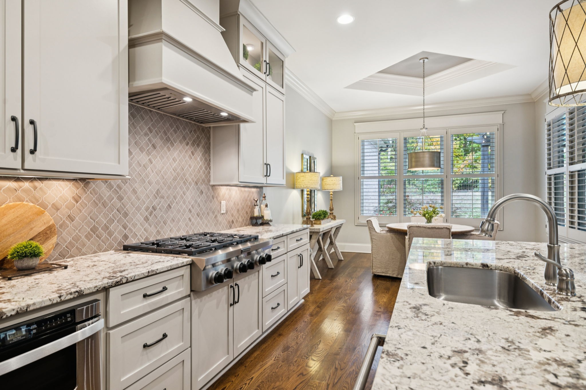 1741 Ravello Way Brentwood, TN 37027 - Photo 22 of 80 a kitchen with granite countertop a stove sink and cabinets
