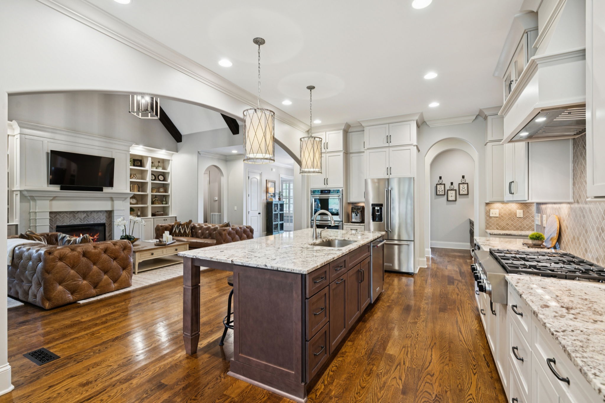 1741 Ravello Way Brentwood, TN 37027 - Photo 23 of 80 a large kitchen with stainless steel appliances granite countertop plenty wooden cabinets counter space and living room view