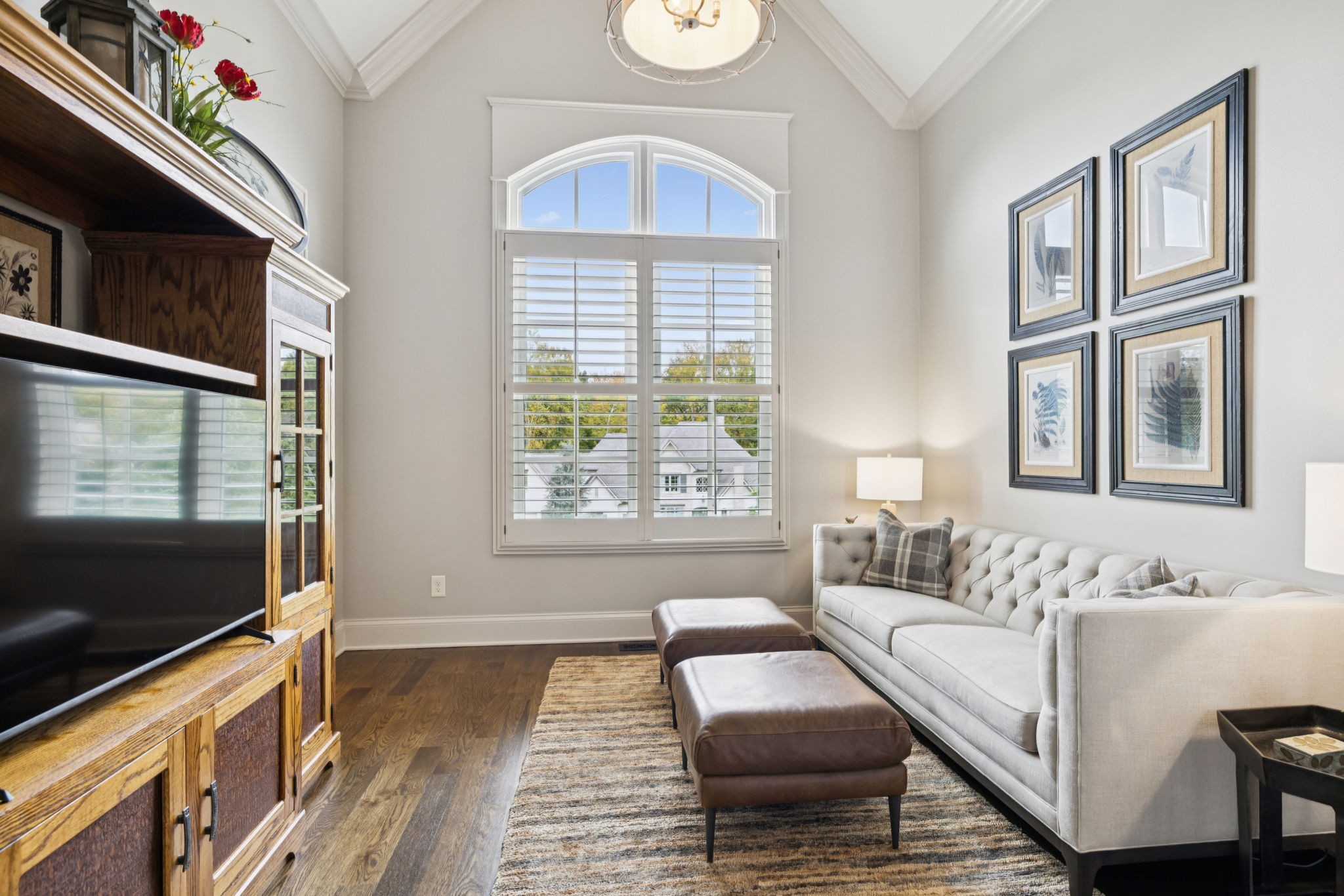 1741 Ravello Way Brentwood, TN 37027 - Photo 38 of 80 a living room with furniture a flat screen tv and a window