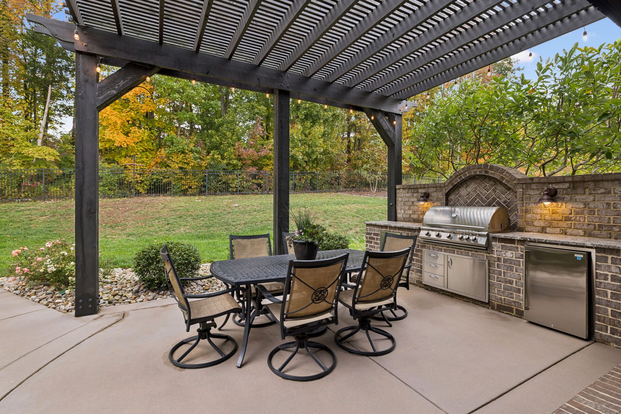 1741 Ravello Way Brentwood, TN 37027 - Photo 65 of 80 a view of a patio with chairs and table under an umbrella