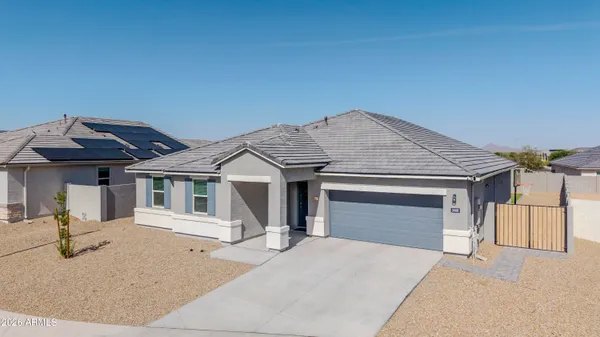a front view of a house with garage