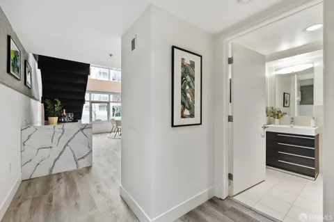 a view of an entryway and livingroom with furniture