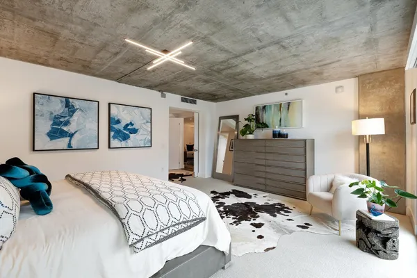 a bedroom with a bed and a table