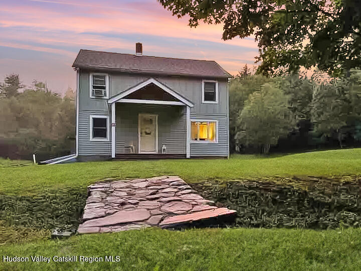 209 Griffin Road East Jewett, NY 12424 - Photo 1 of 34 a front view of a house with garden