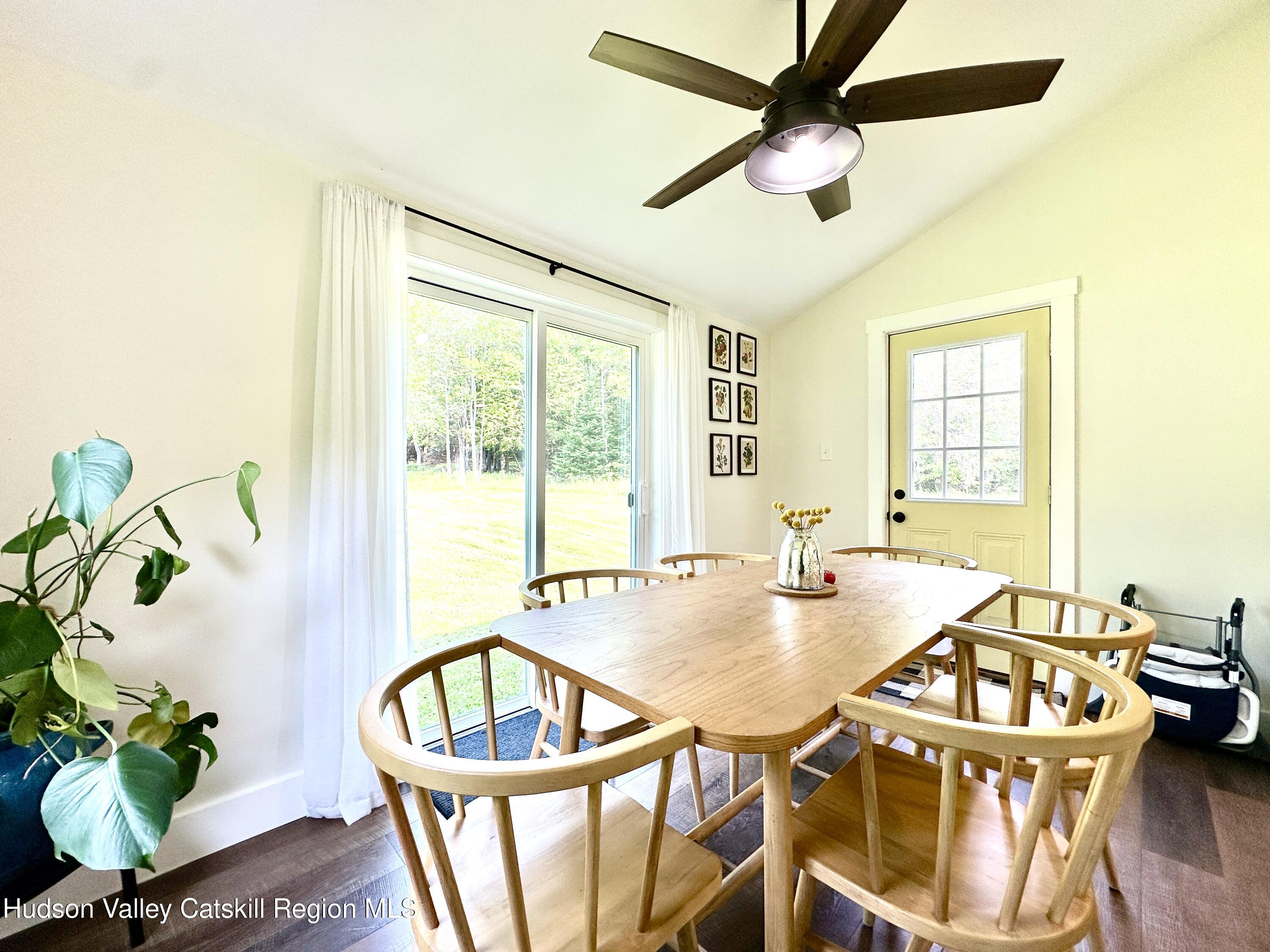 209 Griffin Road East Jewett, NY 12424 - Photo 12 of 34 a view of a dining room with furniture window and wooden floor