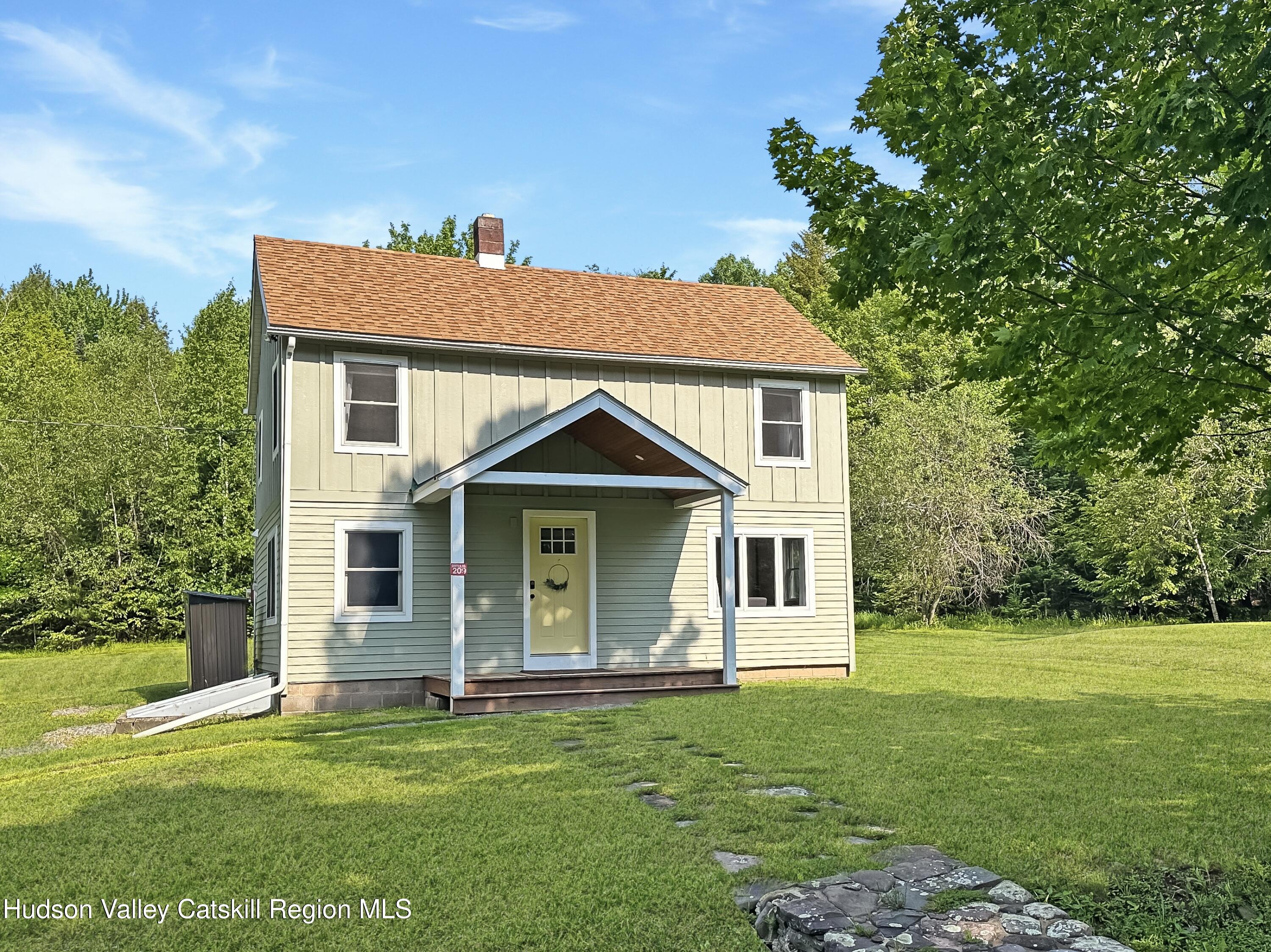 209 Griffin Road East Jewett, NY 12424 - Photo 25 of 34 a front view of a house with a garden