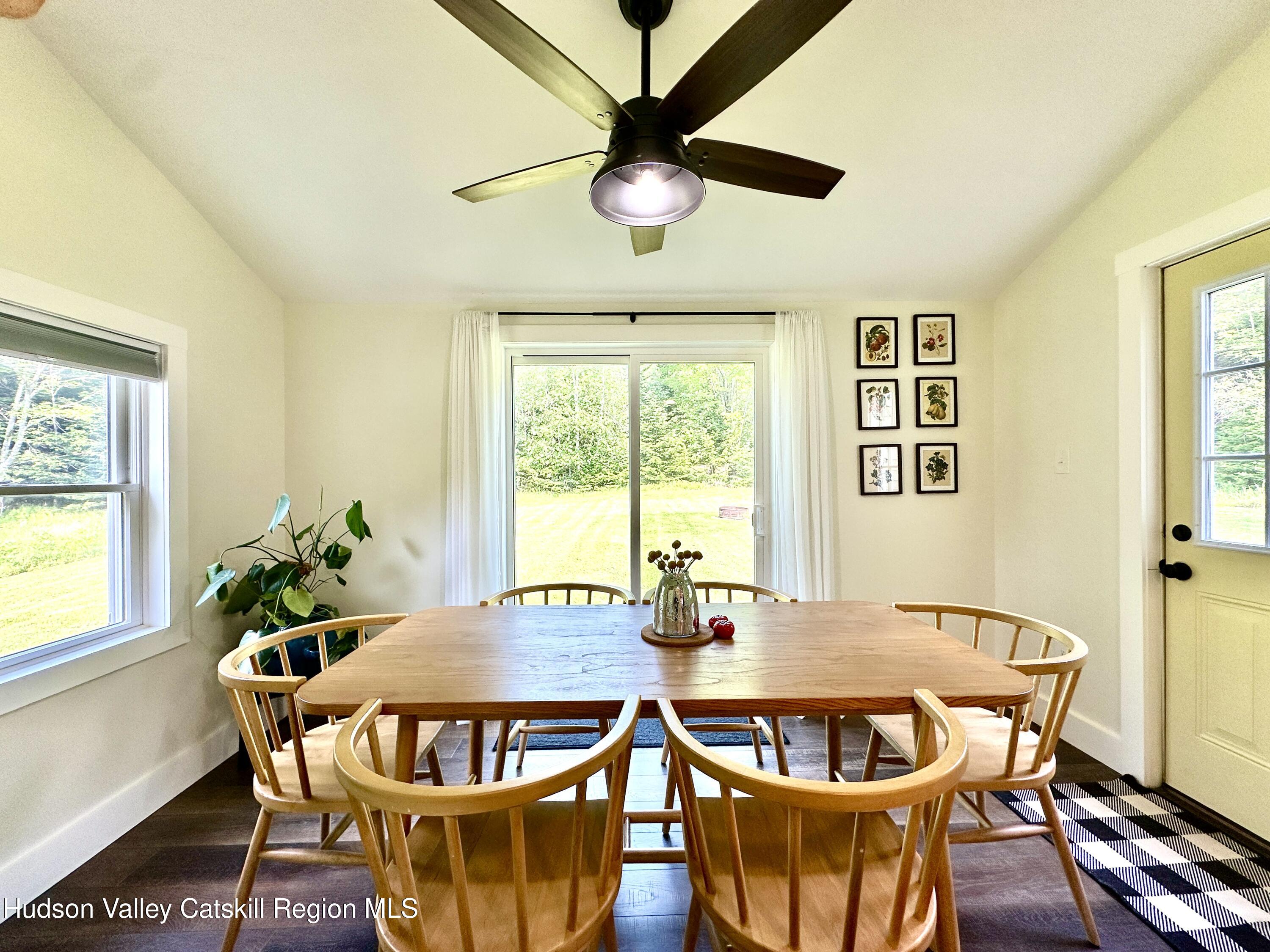 209 Griffin Road East Jewett, NY 12424 - Photo 10 of 34 a dining room with furniture a rug and a potted plant
