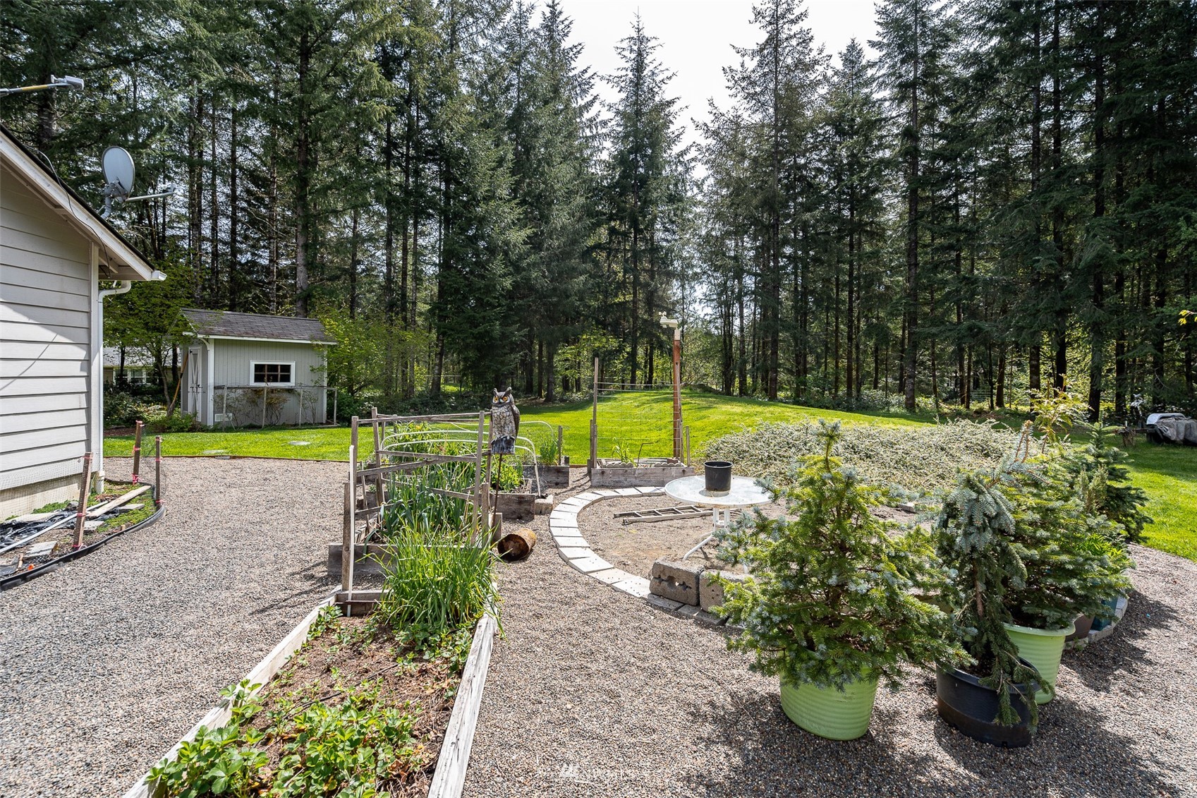 101-04 Hawkins Road Winlock, WA 98596 - Photo 11 of 40 a view of a swimming pool with a patio and garden