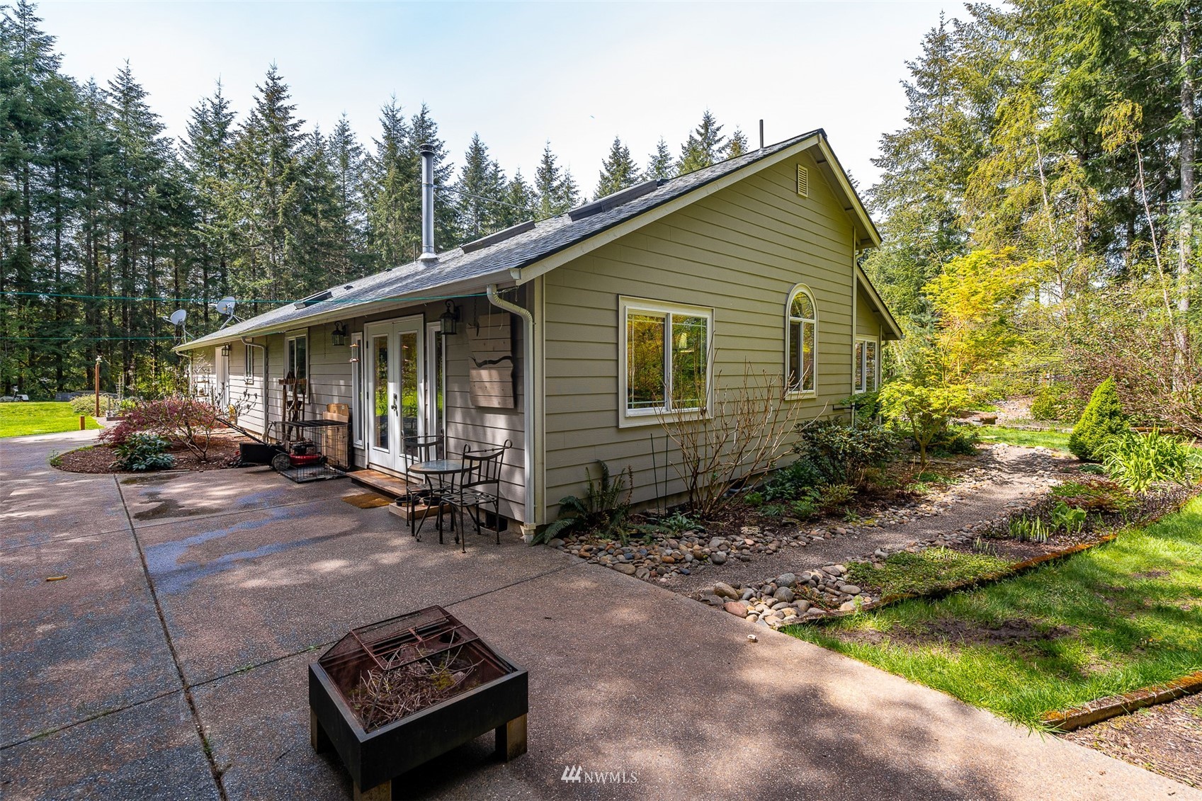 101-04 Hawkins Road Winlock, WA 98596 - Photo 14 of 40 a view of a house with backyard and trees