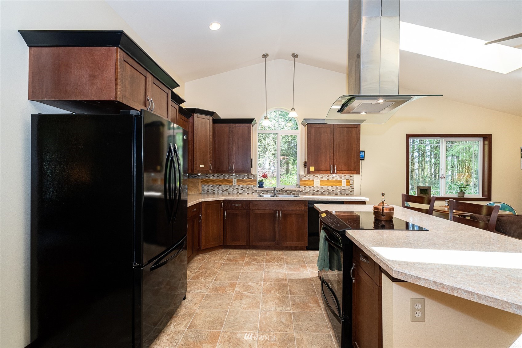 101-04 Hawkins Road Winlock, WA 98596 - Photo 31 of 40 a kitchen with a sink refrigerator and cabinets