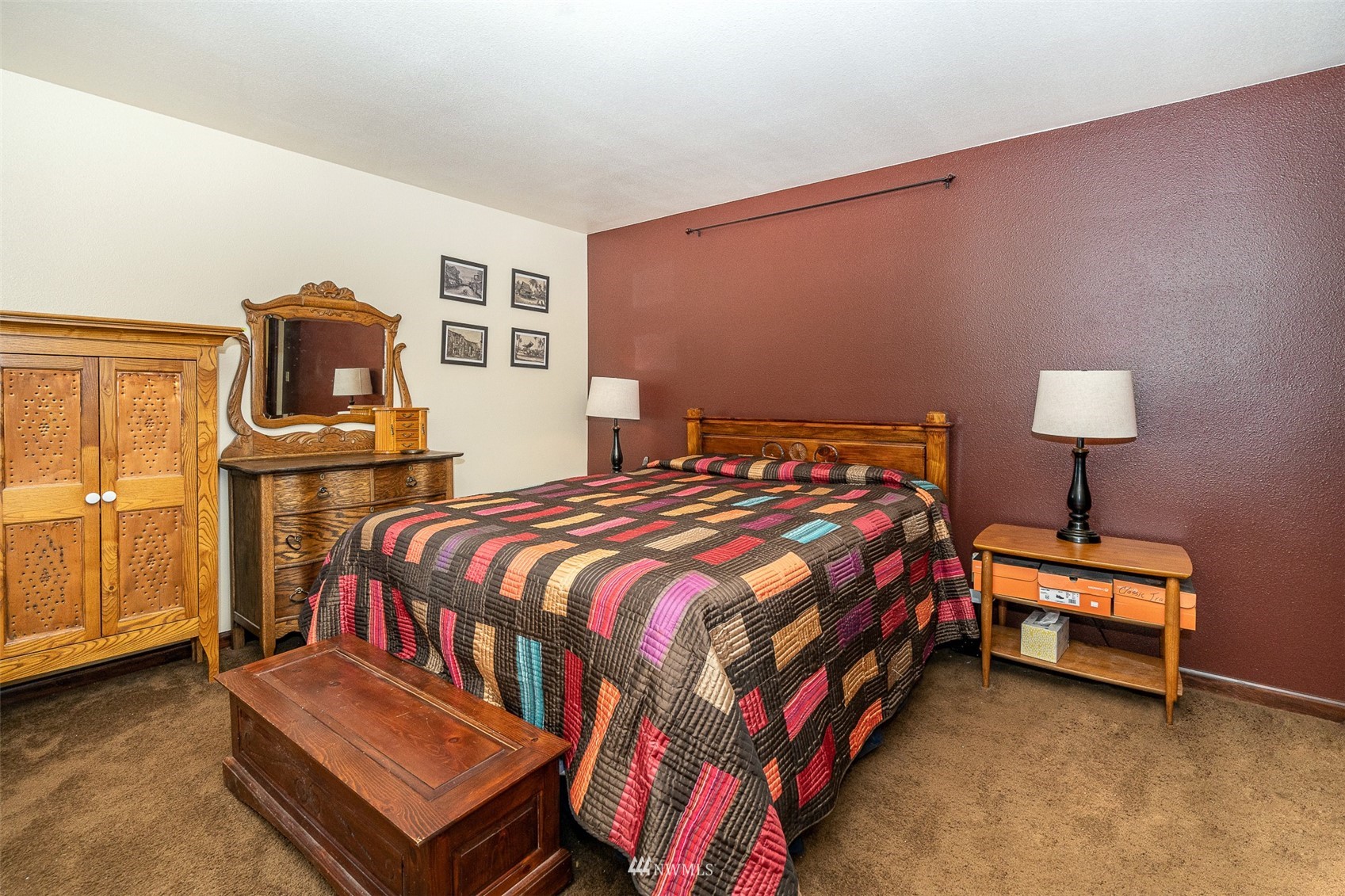 101-04 Hawkins Road Winlock, WA 98596 - Photo 35 of 40 a bedroom with a bed and lamp on table