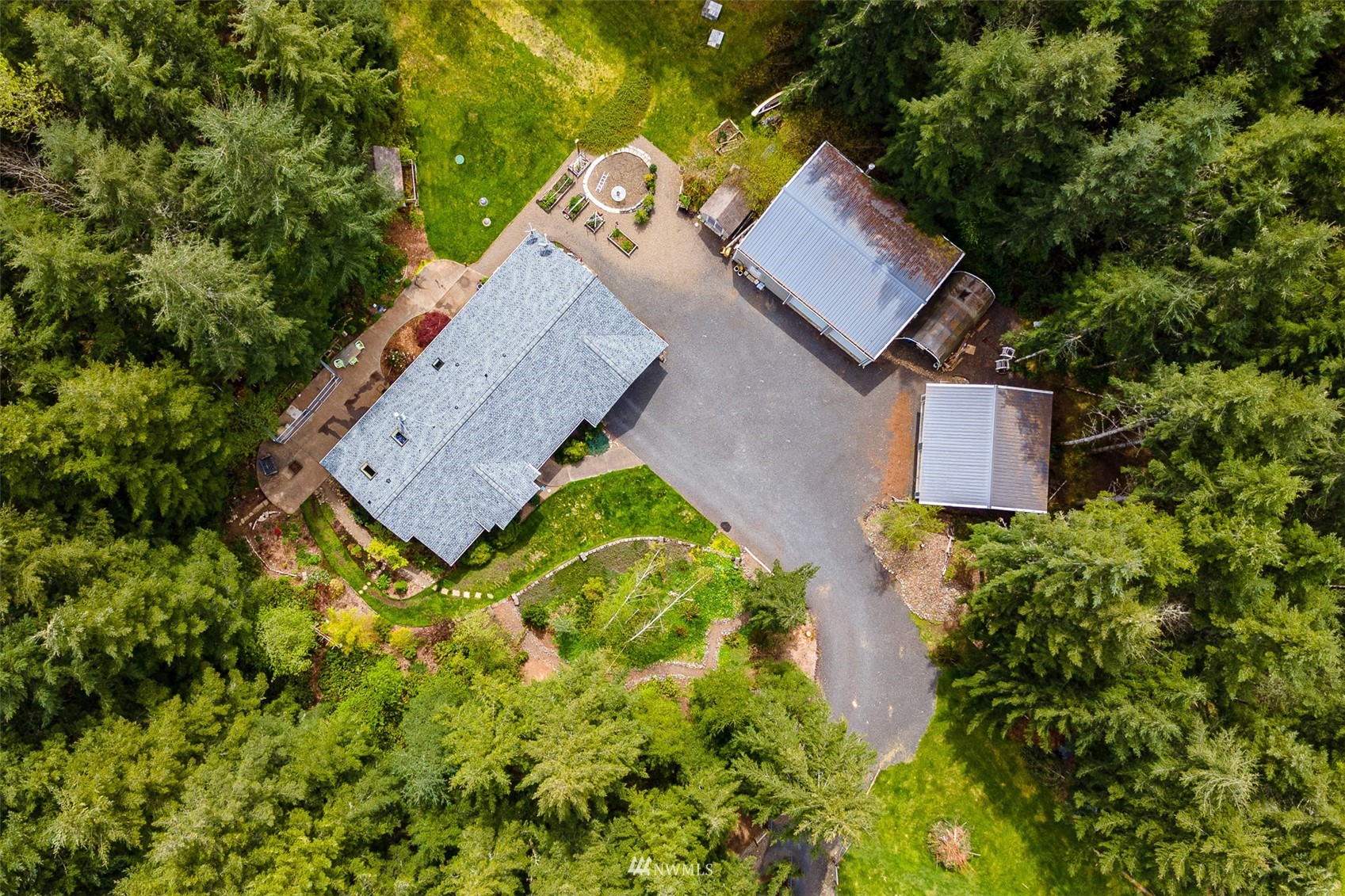 101-04 Hawkins Road Winlock, WA 98596 - Photo 5 of 40 an aerial view of a house with swimming pool and garden space
