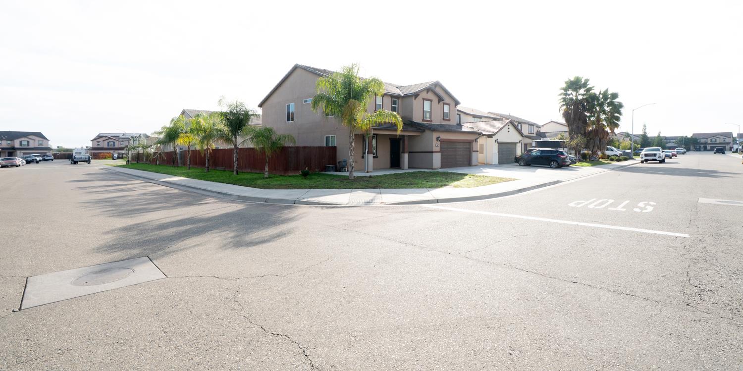 59 Rancho Santa Fe Drive Madera, CA 93638 - Photo 2 of 3 a view of a city street and a building