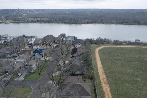 an aerial view of a house with a yard
