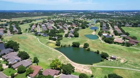 a view of a swimming pool with a lake view