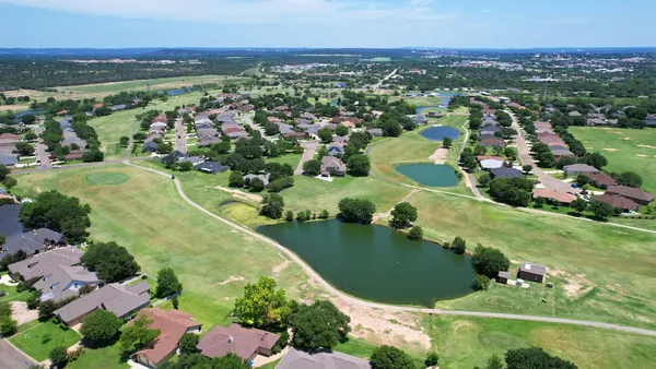 a view of a swimming pool with a lake view