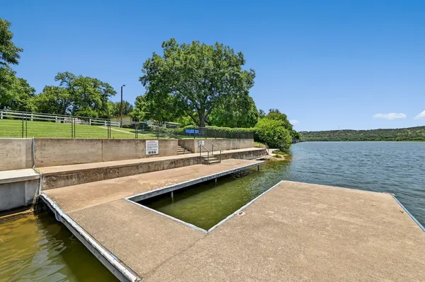 a view of a lake with houses in the background