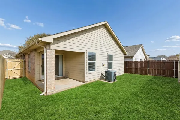 a view of a backyard with plants and a backyard