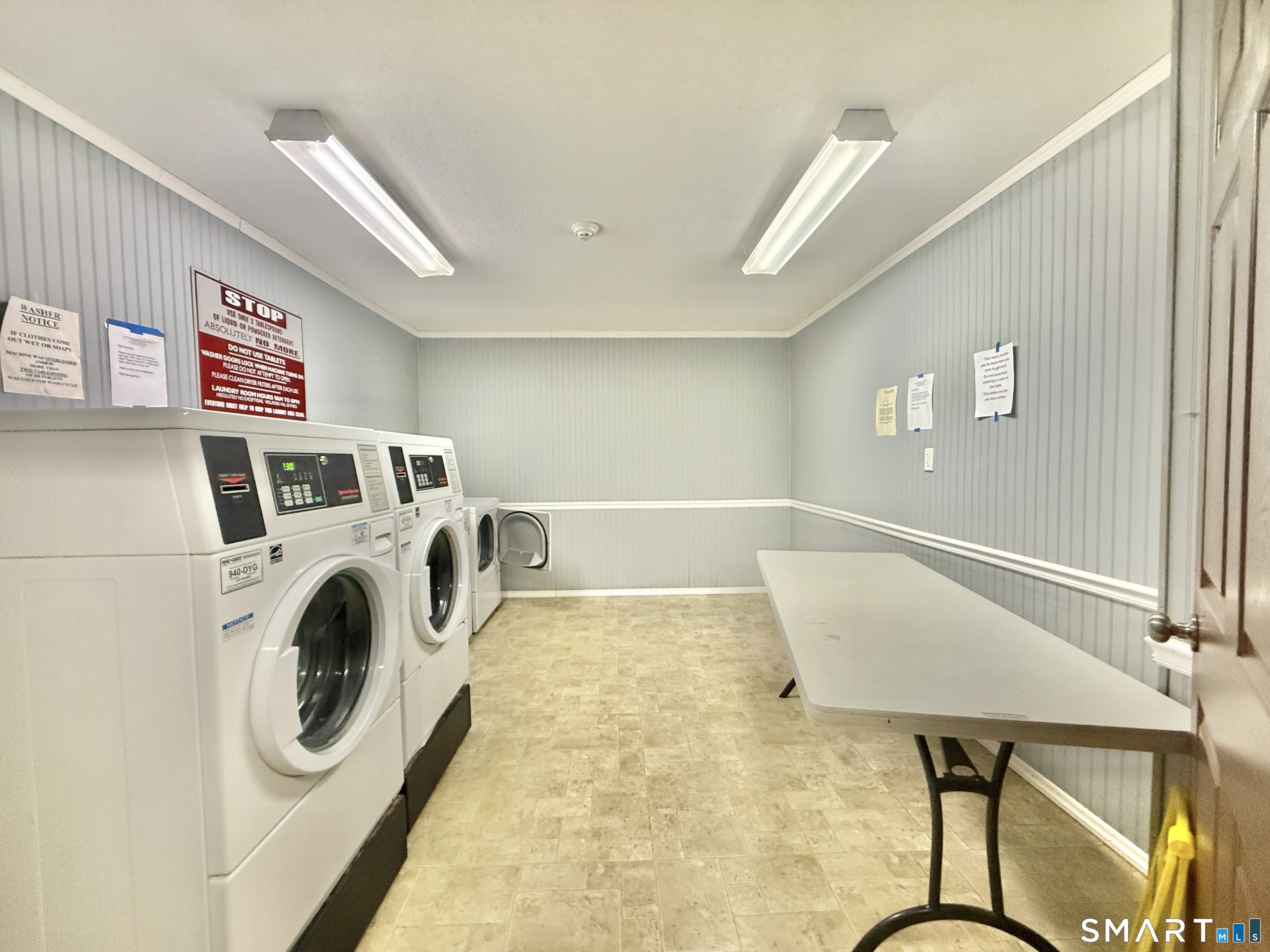 34 A Padanaram Road, Unit 127 Danbury, CT 06811 - Photo 12 of 13 a utility room with dryer and washer