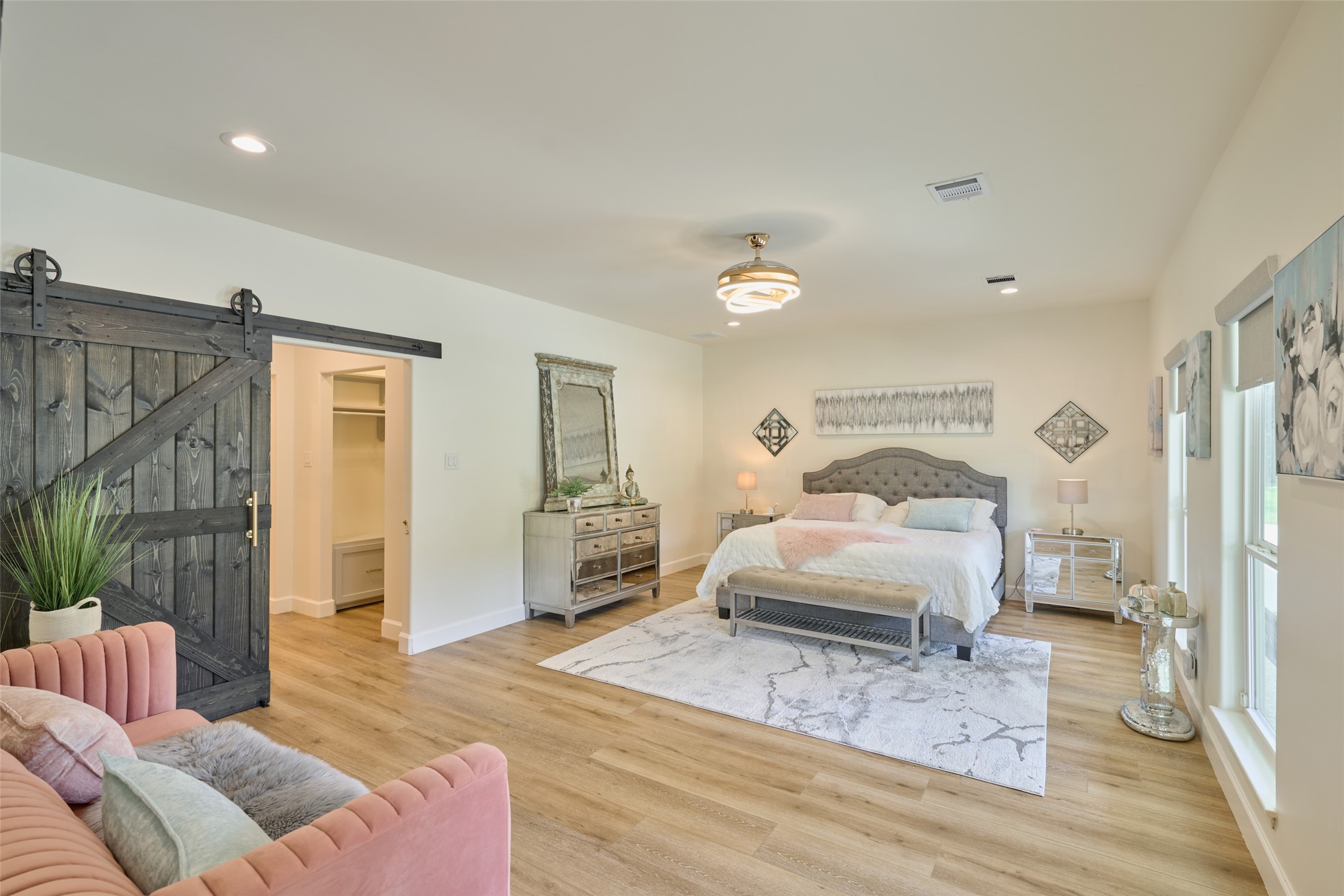 2218 Honea Egypt Road Magnolia, TX 77354 - Photo 28 of 50 Spacious master suite with stylish sliding barn door.