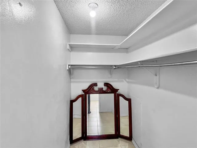 a view of a hallway with closet