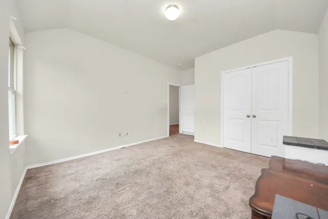 an empty room with wooden floor
