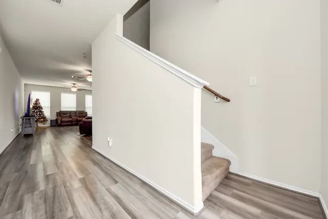 a view of a living room with furniture and a fireplace