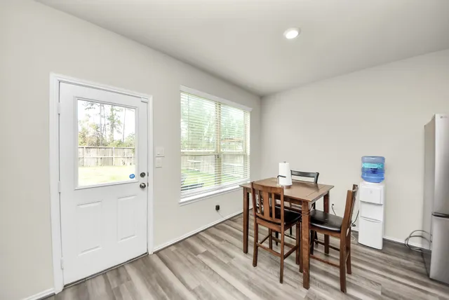 a view of a dining room with furniture window and outside view