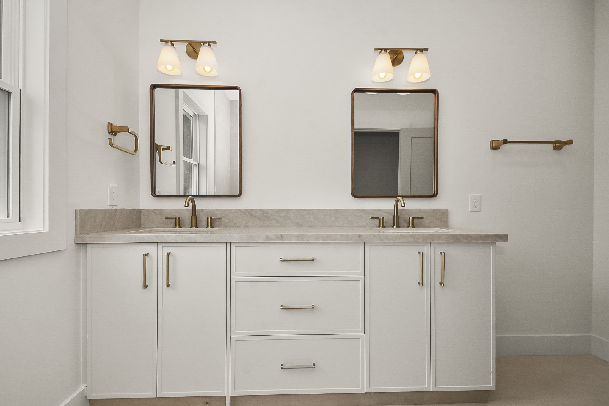 1109 Tabor Street Houston, TX 77009 - Photo 30 of 38 a bathroom with double vanity sinks and a mirror